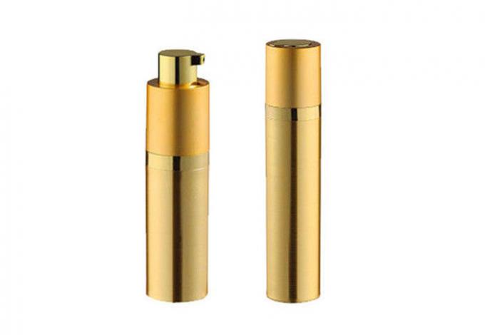 Botella cosmética cilíndrica de oro de la bomba de vacío